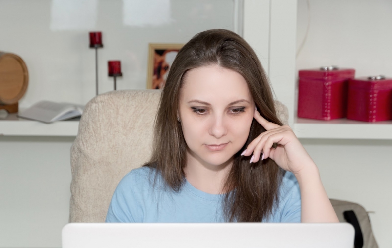 Woman reviewing digital waiver on her laptop