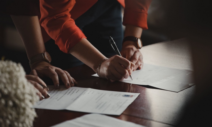 A woman signing a liability waiver