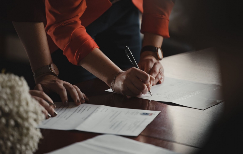 A woman signing a liability waiver