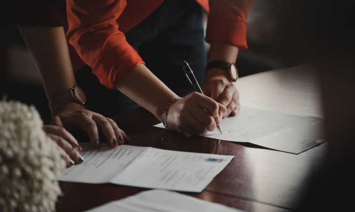 Woman signing a dance studio waiver template