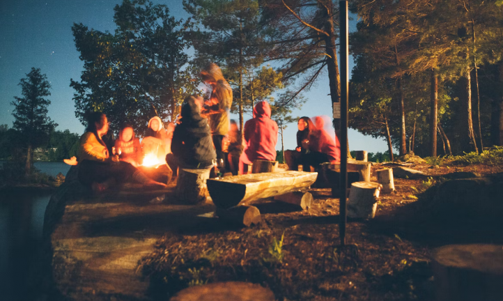 Children sitting in front of a campfire