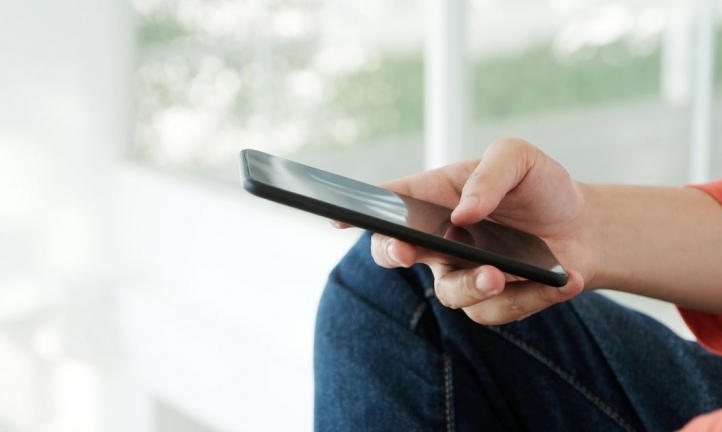 Person filling out an online form on a phone