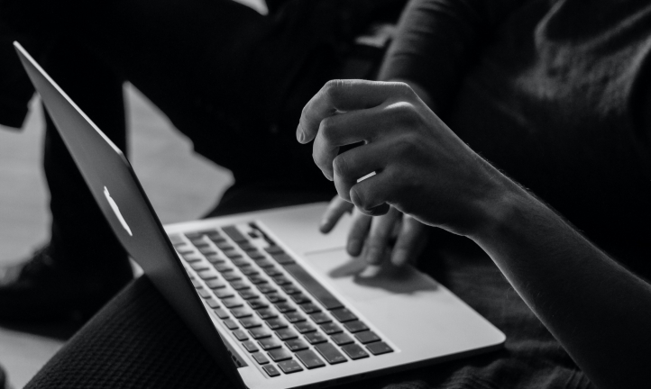 person typing on the laptop